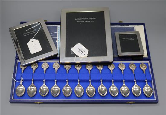 A set of silver Twelve Zodiac Spoons by John Pinches and three silver photograph frames, various, all boxed